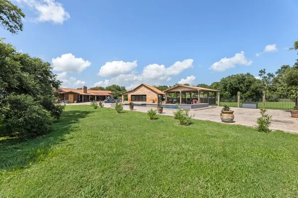 a view of a house with a big yard