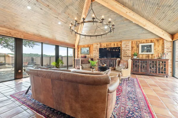 a living room with furniture and a table