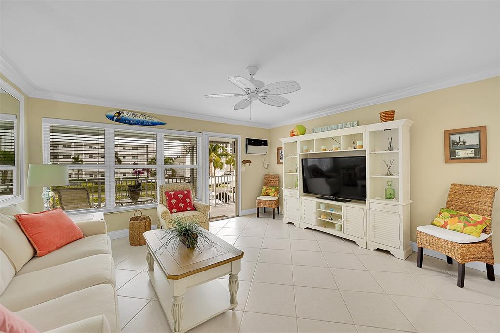 1110 North Riverside Drive, Unit 24 Pompano Beach, FL 33062 - Photo 15 of 43 BEING SOLD FURNISHED (some exclusions) so you could just bring your Clothes and Toothbrush to CALL IT HOME! Your 2nd Floor Condo HAS NO ONE ABOVE YOU, is OVERLOOKING THE POOL, HAS AMAZING VIEWS INCLUDING INTRACOASTAL from inside your Condo or your OPEN BALCONY. You have to see how Quiet, Bright, Open and Inviting this unit is with these HUGE IMPACT WINDOWS AND DOOR WITH RETRACTABLE SCREEN DOOR and Open Floor Plan.