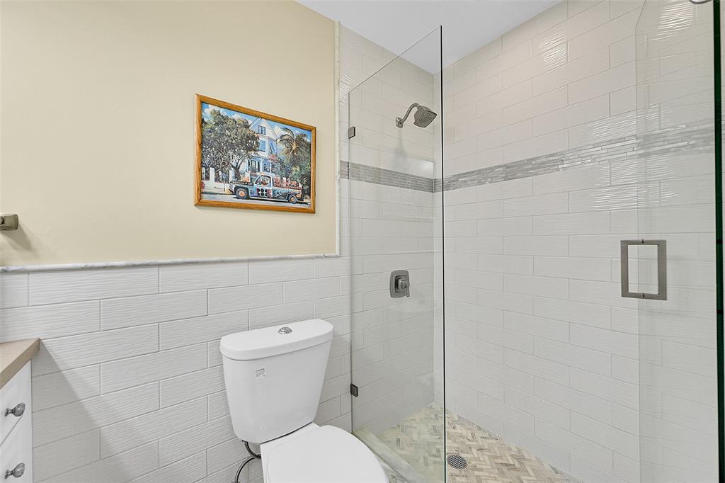 1110 North Riverside Drive, Unit 24 Pompano Beach, FL 33062 - Photo 7 of 43 Lots of Storage and the Stylish Subway Tiles and Huge Glass Enclosed Shower. Check out these AMAZING FINISHES that were brought in to match the rest of your AMAZING CONDO. Plenty of Bathroom Vanity Counter Space. No this isn't a spa, This could be your home! YOU WILL LOVE WHERE YOU LIVE!