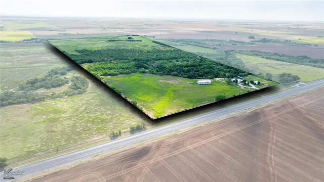 a view of a yard with an ocean view