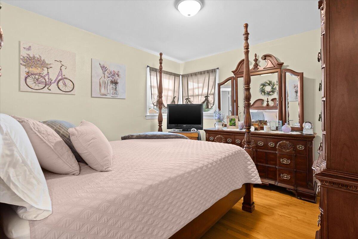 218 Post Road Roanoke, VA 24019 - Photo 17 of 24 a bedroom with a bed and wooden floor