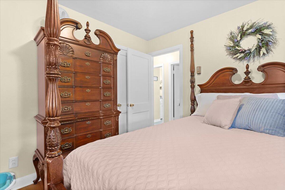 218 Post Road Roanoke, VA 24019 - Photo 18 of 24 a bedroom with a bed and a potted plant