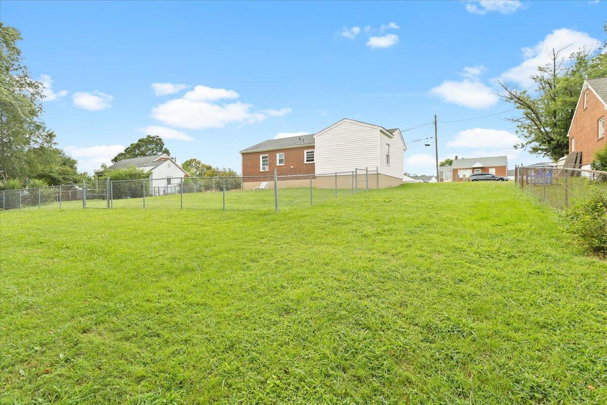 218 Post Road Roanoke, VA 24019 - Photo 22 of 24 a view of a large garden with plants and large trees