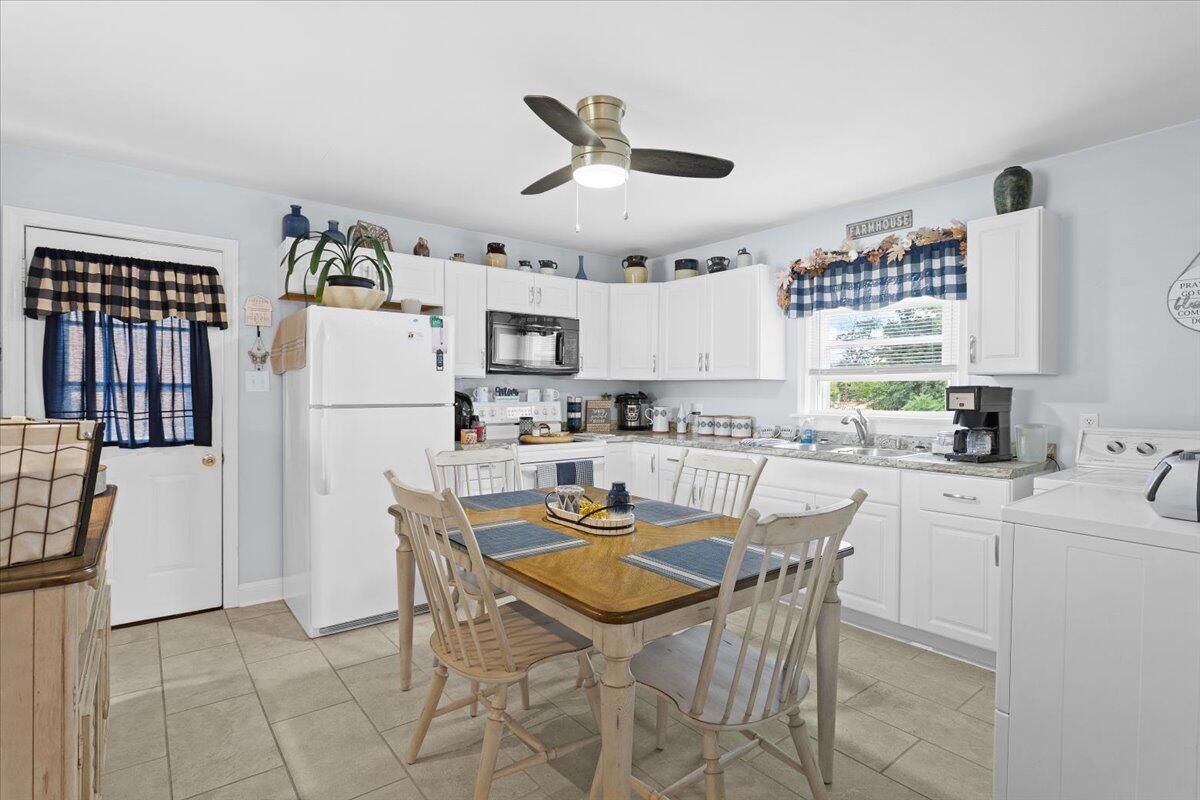 218 Post Road Roanoke, VA 24019 - Photo 8 of 24 a kitchen with white cabinets and white appliances