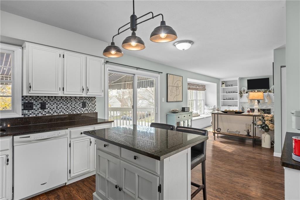 28 McBride Road Canonsburg, PA 15317 - Photo 12 of 33 a kitchen with granite countertop a sink cabinets and wooden floor