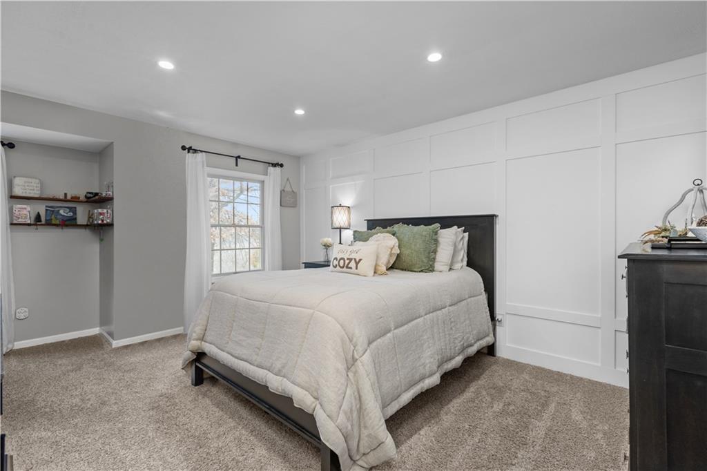 28 McBride Road Canonsburg, PA 15317 - Photo 22 of 33 a bed sitting in a room next to a lamp and a window