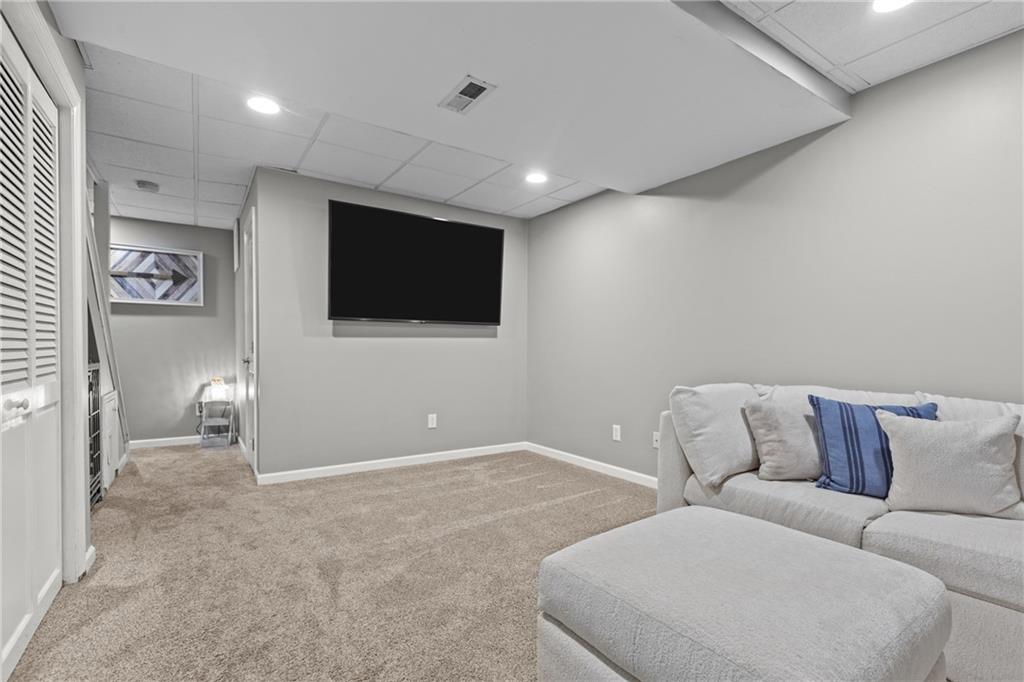 28 McBride Road Canonsburg, PA 15317 - Photo 27 of 33 a living room with furniture and a flat screen tv