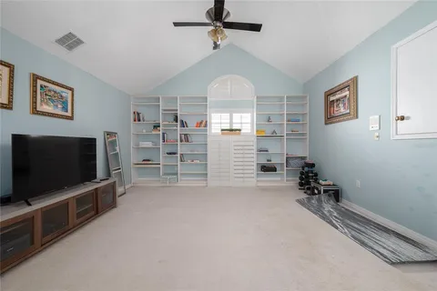 a view of a livingroom with furniture and a flat screen tv