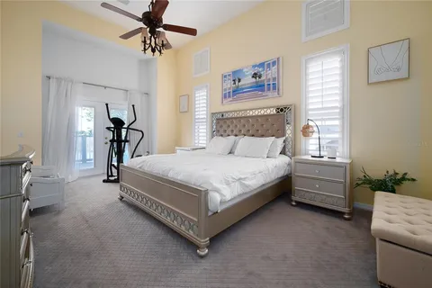 a bed room with a bed and a chandelier