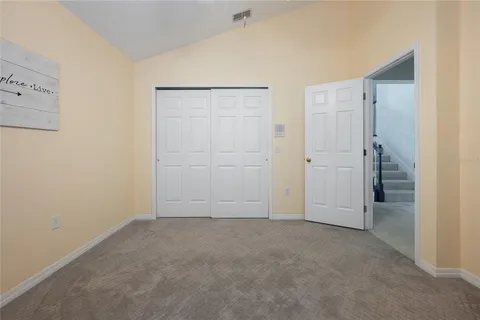 an empty room with closet area