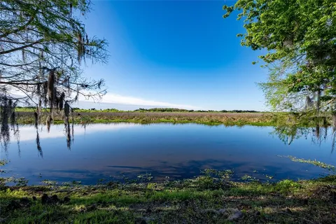 a view of lake with green space