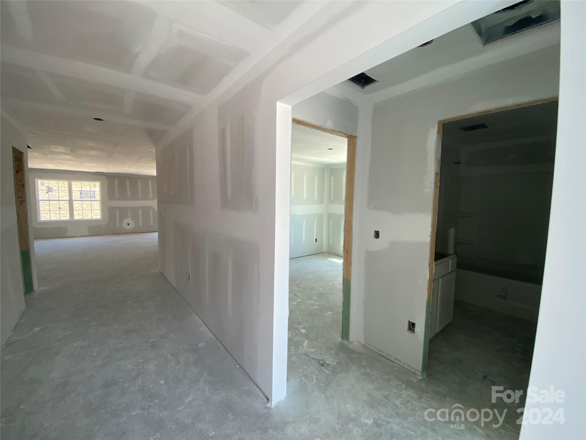 648 Mile Crk Road, Unit 20 Edgemoor, SC 29712 - Photo 18 of 22 wooden floor and a bathroom with sink mirror and window