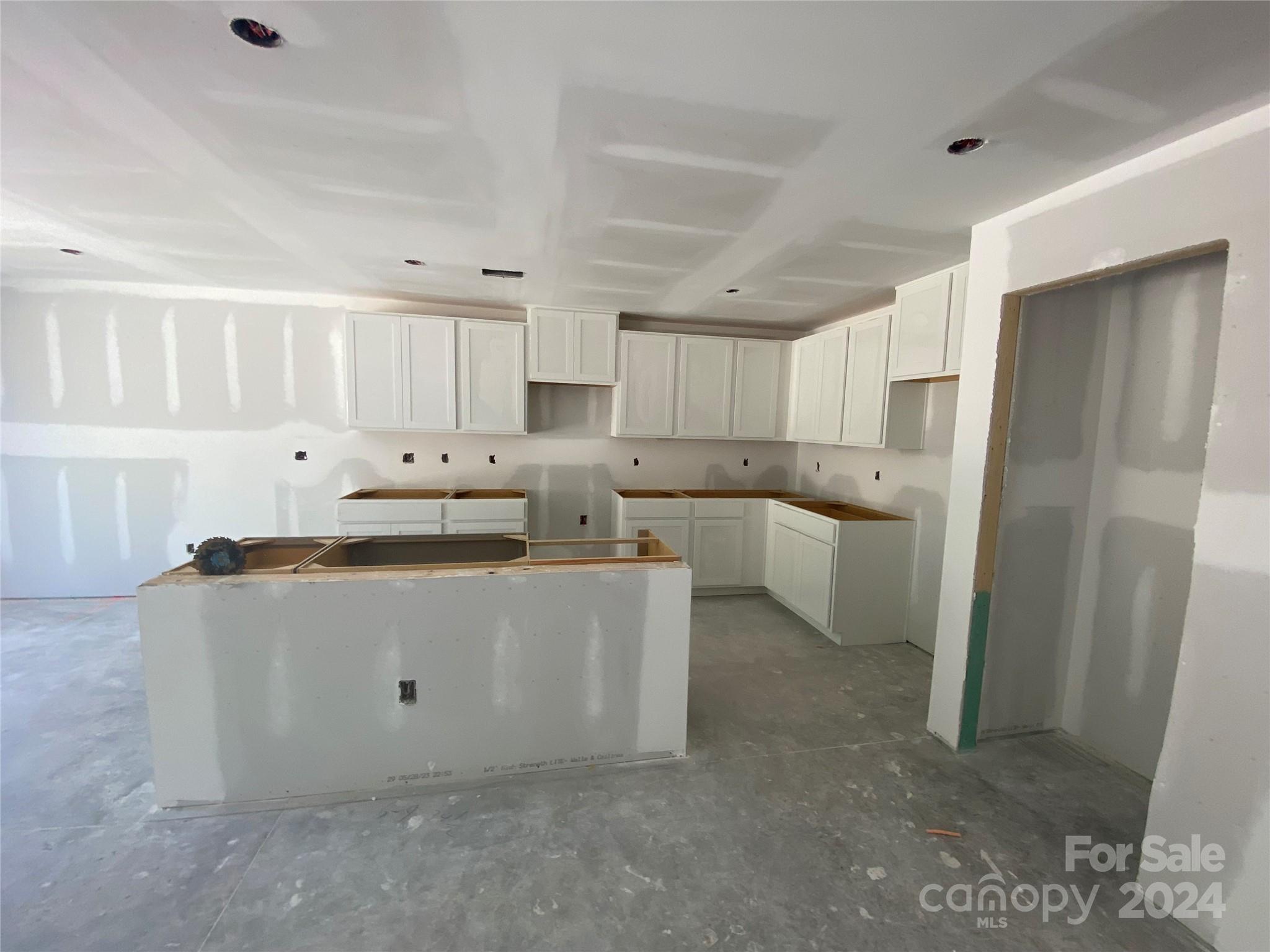 648 Mile Crk Road, Unit 20 Edgemoor, SC 29712 - Photo 20 of 22 a kitchen with stainless steel appliances a refrigerator a sink a stove a microwave and white cabinets
