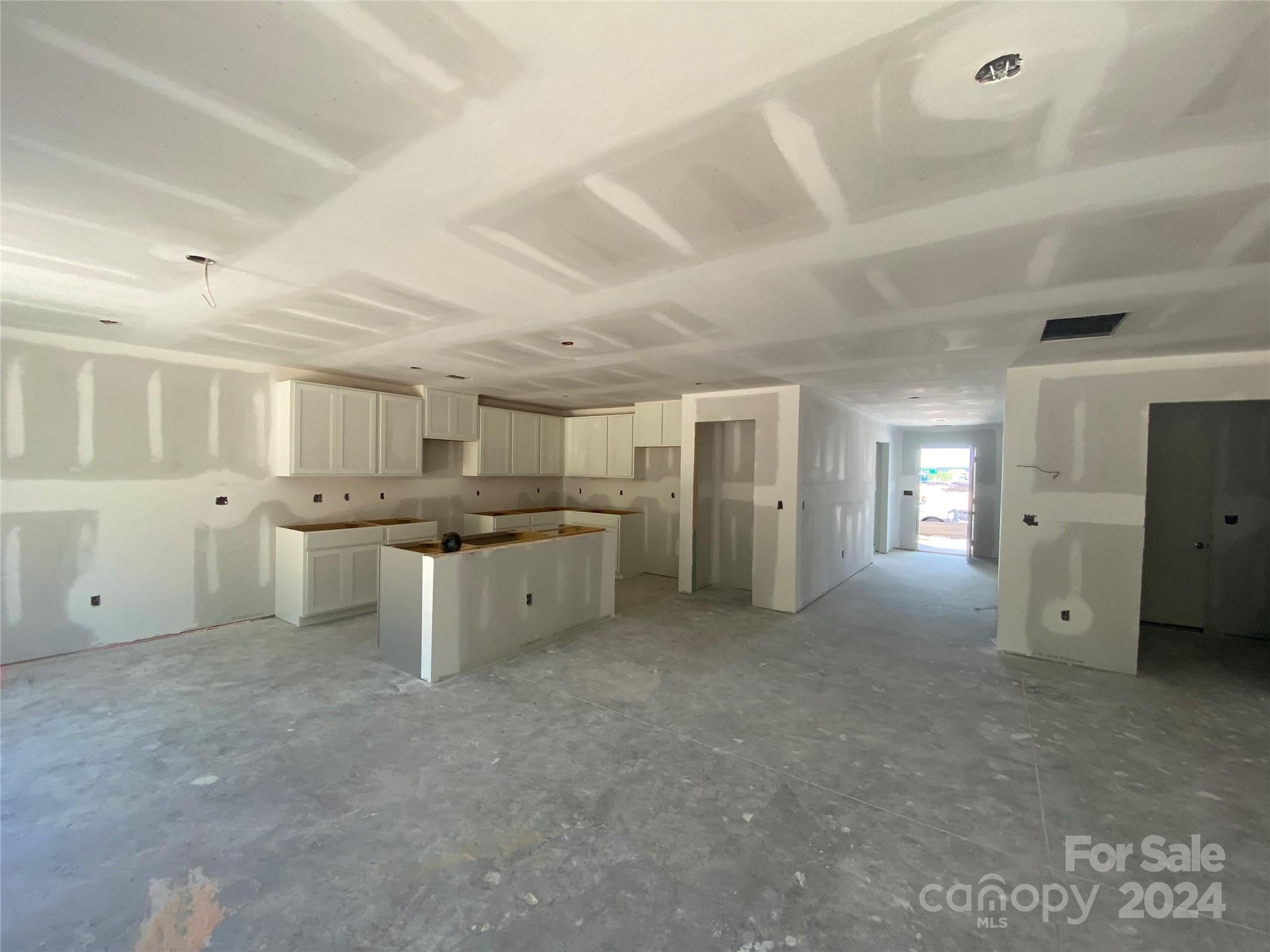 648 Mile Crk Road, Unit 20 Edgemoor, SC 29712 - Photo 21 of 22 a large white kitchen with a white countertops