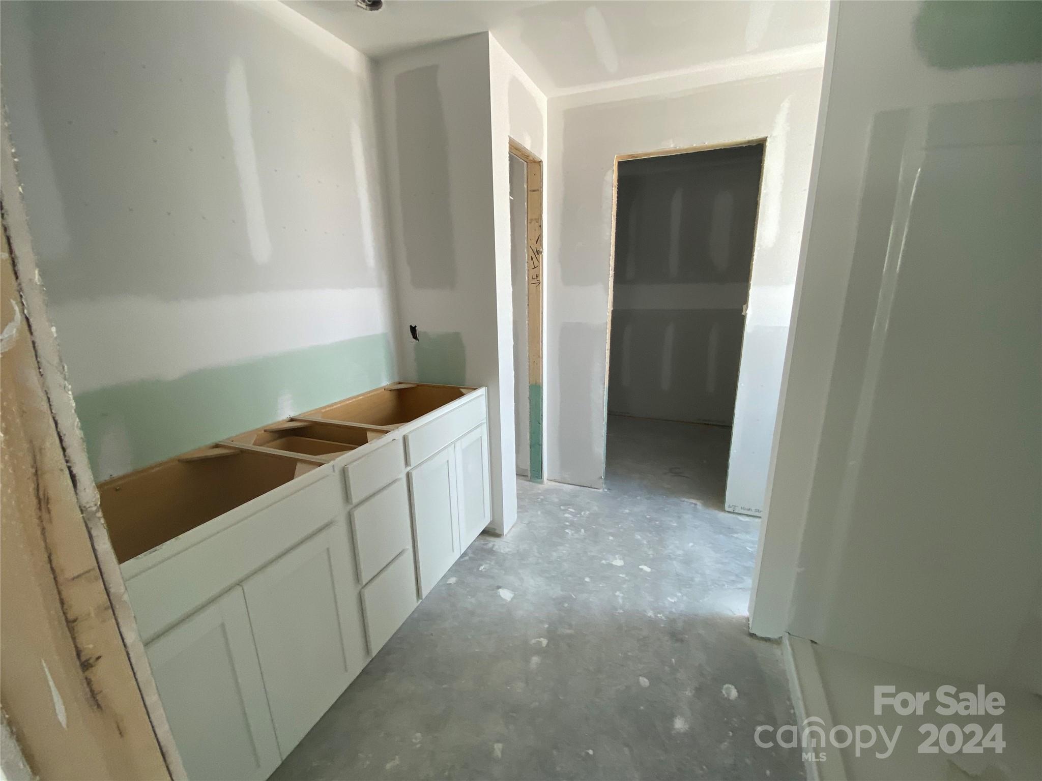648 Mile Crk Road, Unit 20 Edgemoor, SC 29712 - Photo 22 of 22 a kitchen with white cabinets and sink