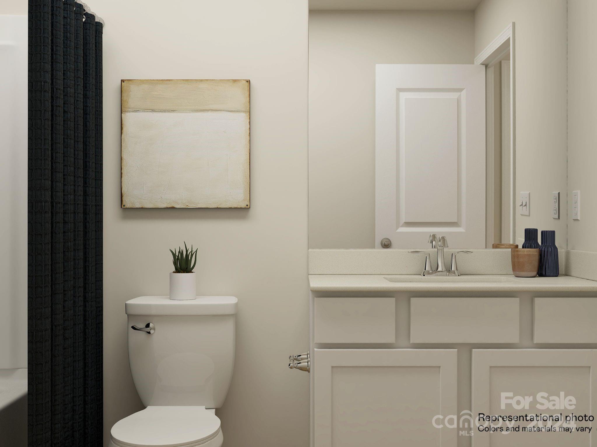 648 Mile Crk Road, Unit 20 Edgemoor, SC 29712 - Photo 4 of 22 a bathroom with a toilet sink and mirror