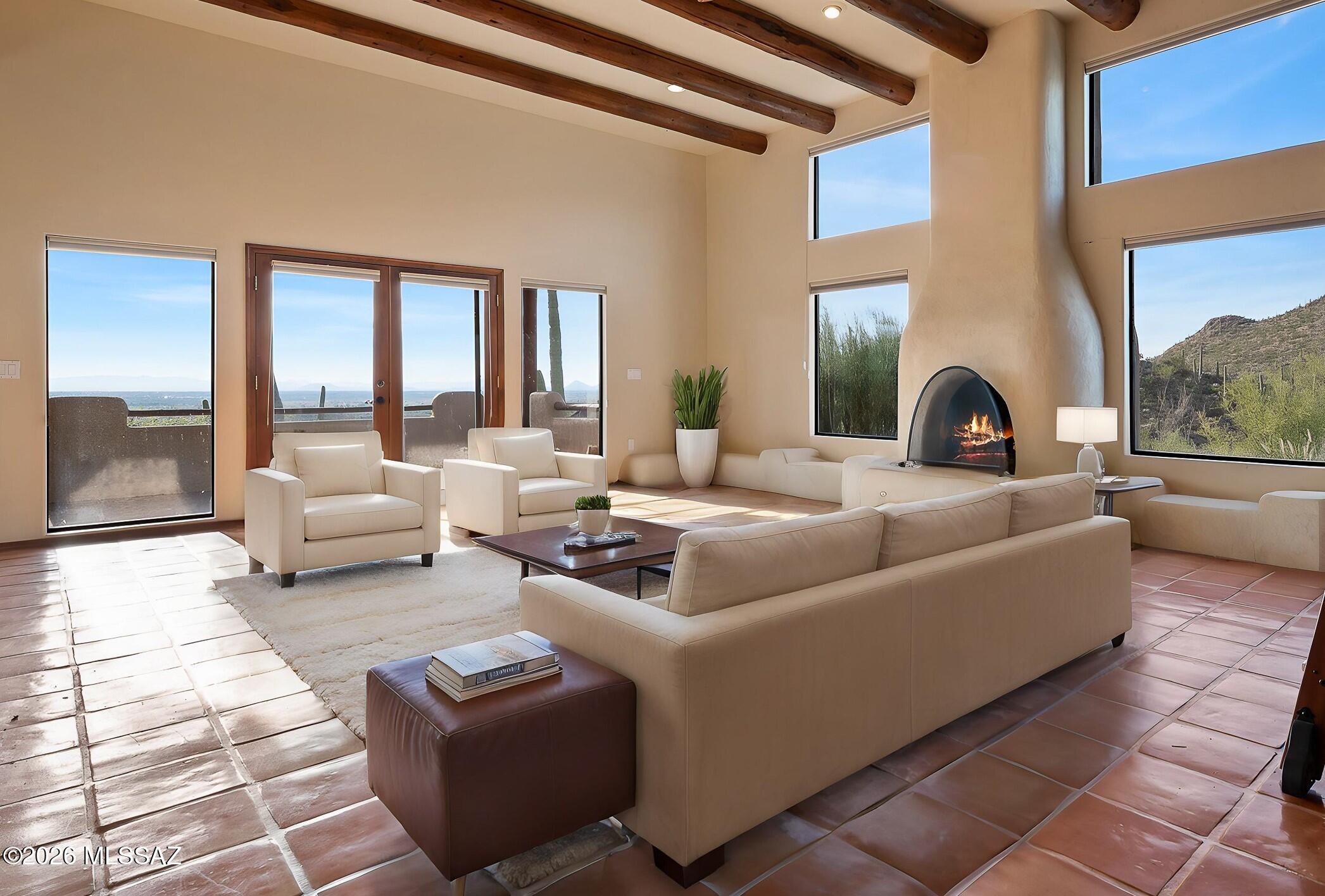 13630 East Sahuaro Sunset Road Tucson, AZ 85749 - Photo 2 of 47 a living room with furniture and a large window