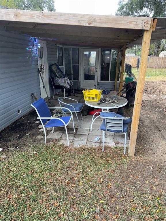 11305 Southeast 76th Avenue Belleview, FL 34420 - Photo 3 of 6 a view of a lounge chair in the patio