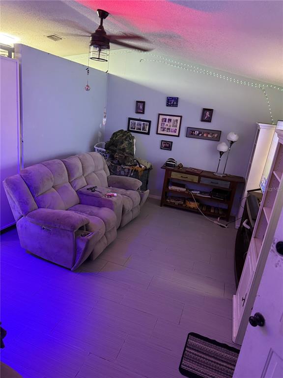 11305 Southeast 76th Avenue Belleview, FL 34420 - Photo 5 of 6 a bed room with a bed and a couch