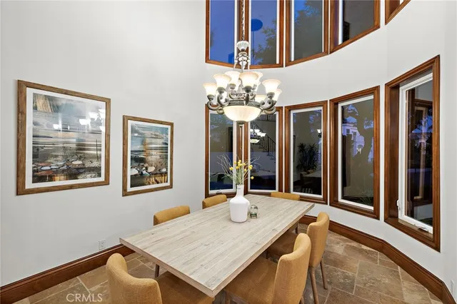 a bedroom with furniture and a large window