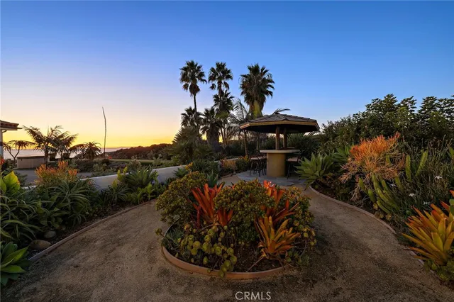 a view of a building with potted plants and more windows
