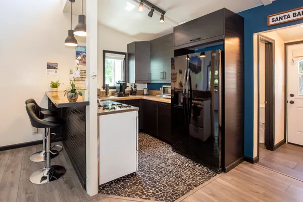 a view of a kitchen and dining room