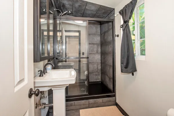 a bathroom with a sink and mirror
