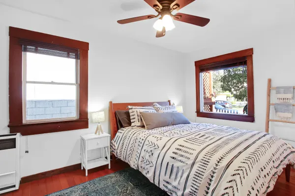 a bedroom with a bed and a window