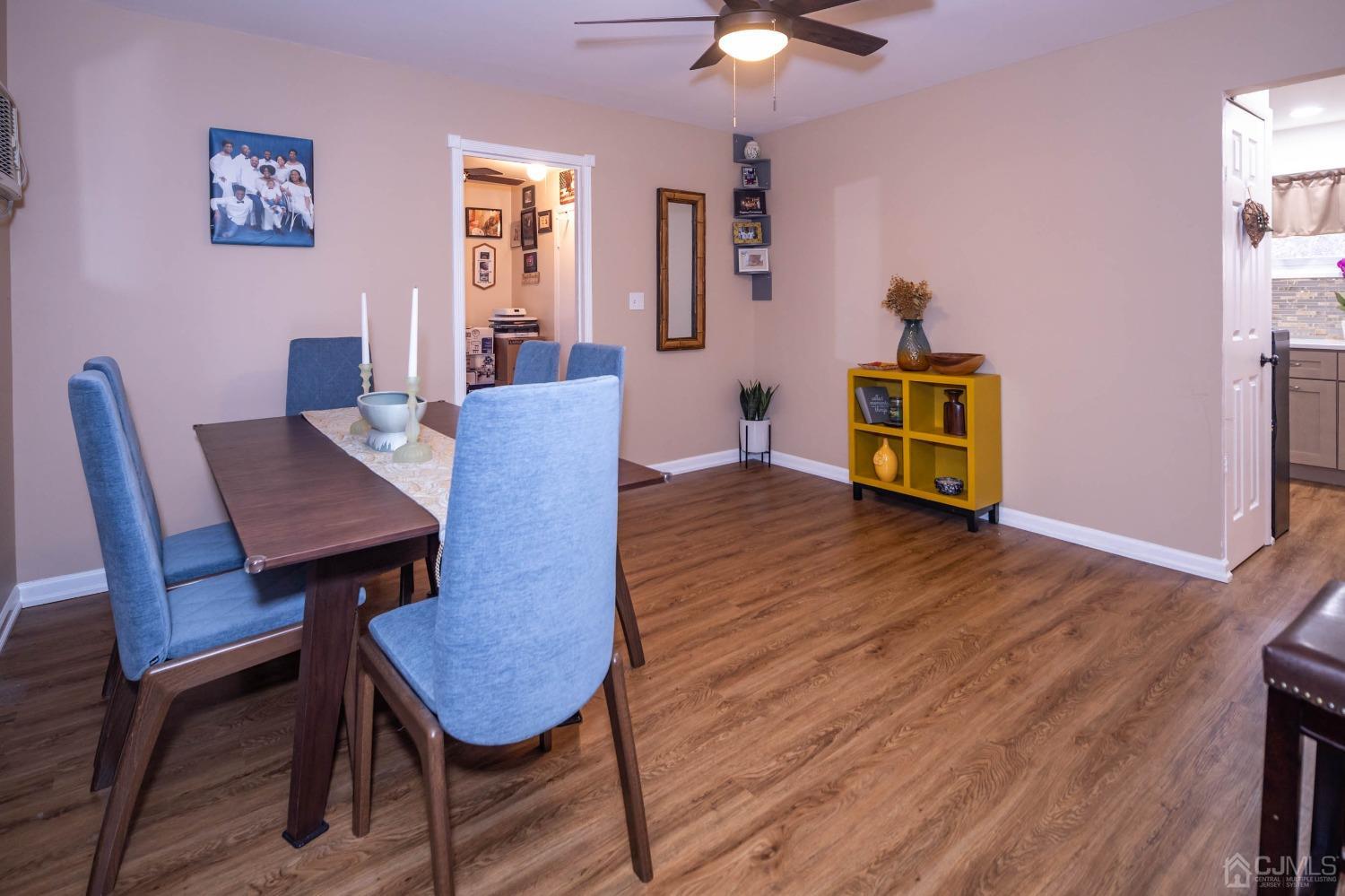 30 Cambridge Road Kendall Park, NJ 08824 - Photo 11 of 43 a view of a dining room with furniture and wooden floor