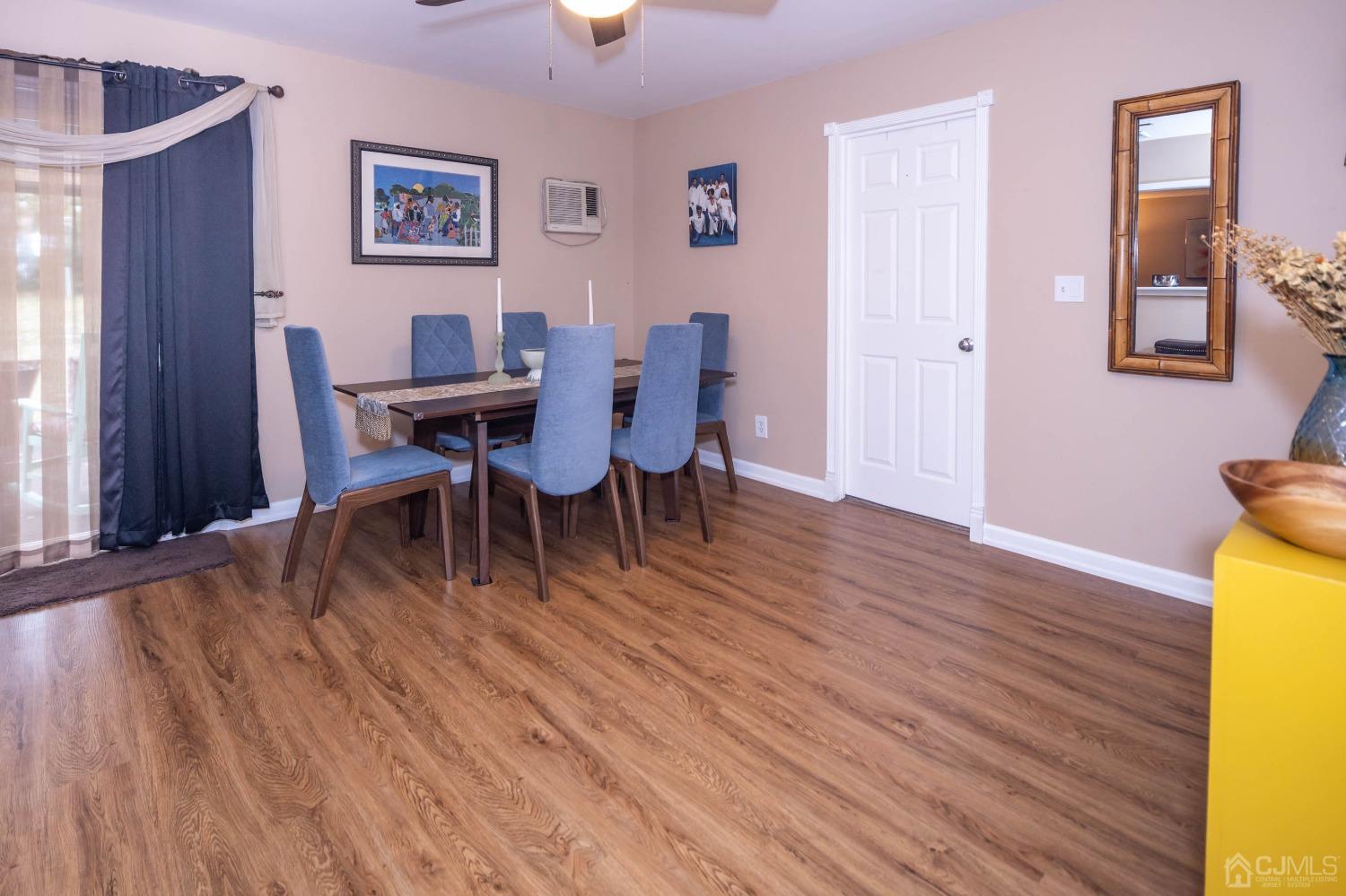 30 Cambridge Road Kendall Park, NJ 08824 - Photo 12 of 43 a view of a dining room with furniture and wooden floor