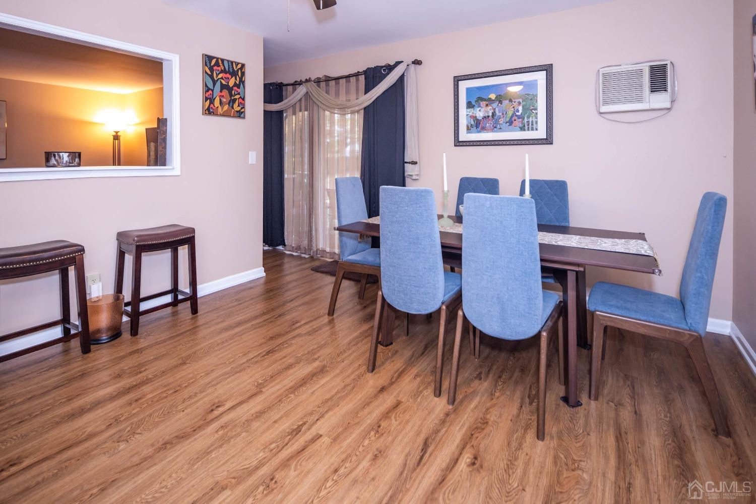 30 Cambridge Road Kendall Park, NJ 08824 - Photo 13 of 43 a view of a dining room with furniture and wooden floor