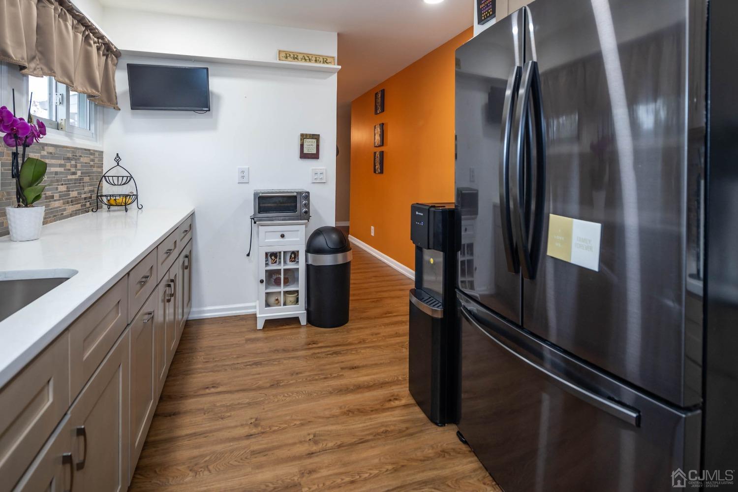 30 Cambridge Road Kendall Park, NJ 08824 - Photo 16 of 43 a kitchen with stainless steel appliances granite countertop a refrigerator and a sink