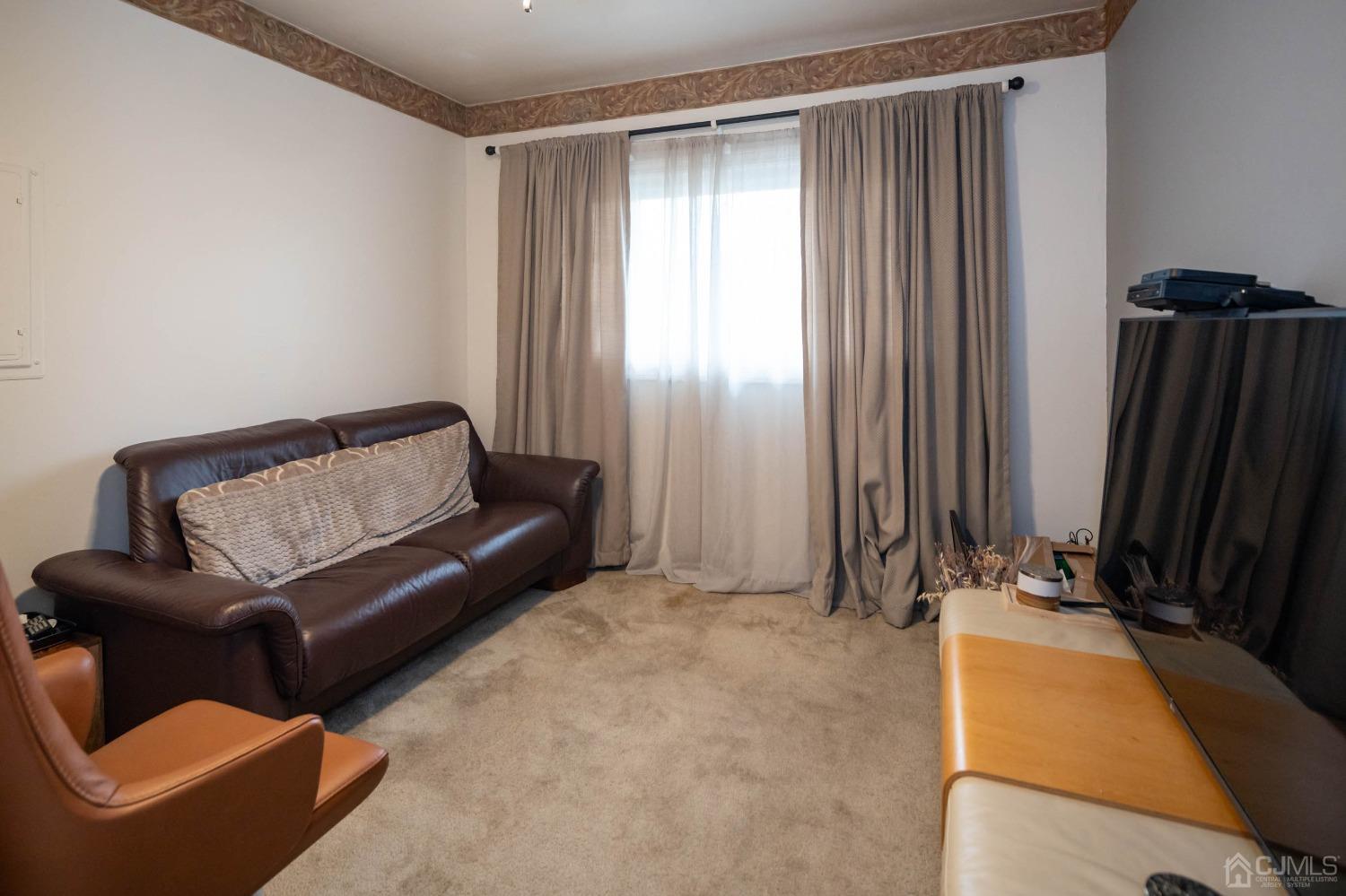 30 Cambridge Road Kendall Park, NJ 08824 - Photo 24 of 43 a living room with furniture rug and a window