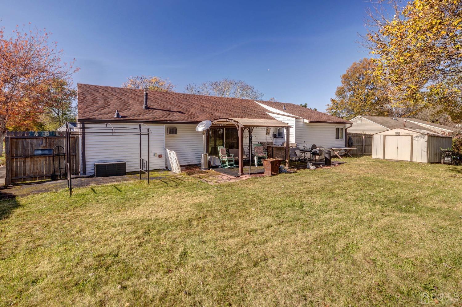 30 Cambridge Road Kendall Park, NJ 08824 - Photo 28 of 43 a front view of a house with a yard