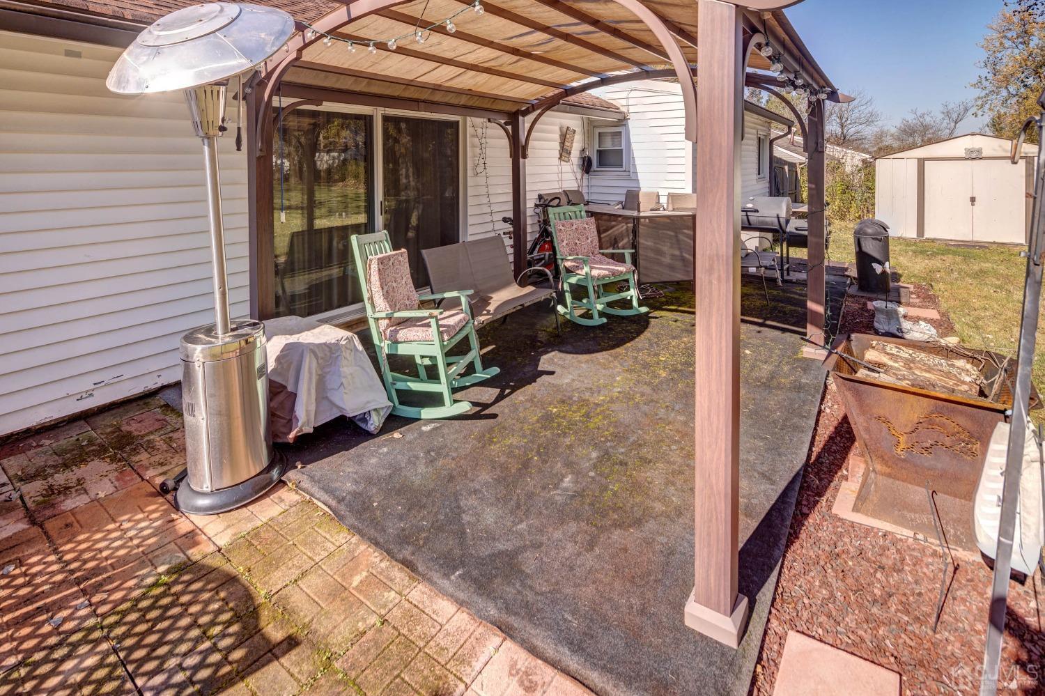 30 Cambridge Road Kendall Park, NJ 08824 - Photo 30 of 43 a view of balcony with two chairs and a rug