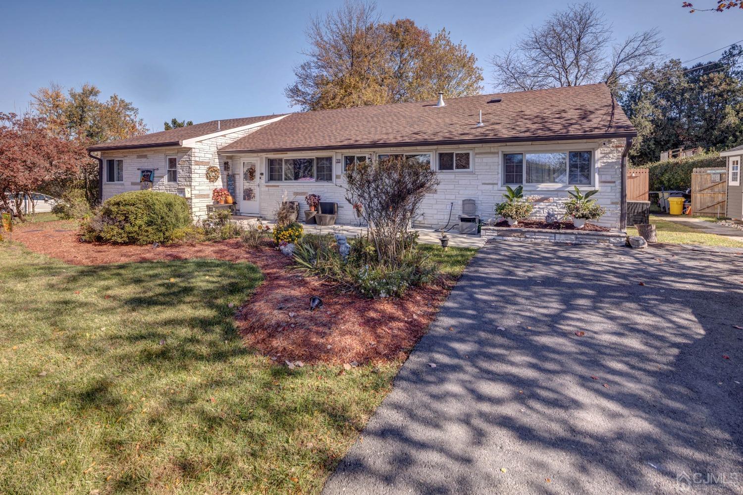 30 Cambridge Road Kendall Park, NJ 08824 - Photo 3 of 43 a view of a house with backyard and sitting area