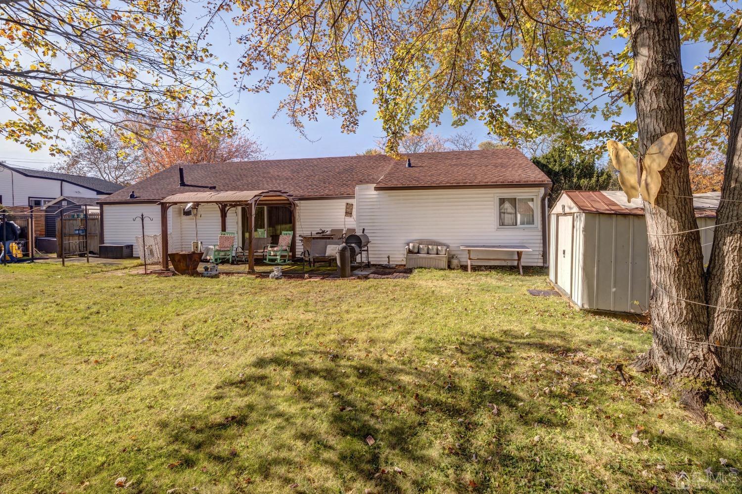 30 Cambridge Road Kendall Park, NJ 08824 - Photo 31 of 43 a front view of a house with a yard and tree