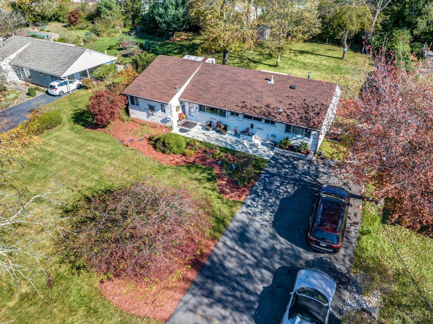30 Cambridge Road Kendall Park, NJ 08824 - Photo 37 of 43 a view of a house with a yard and large trees