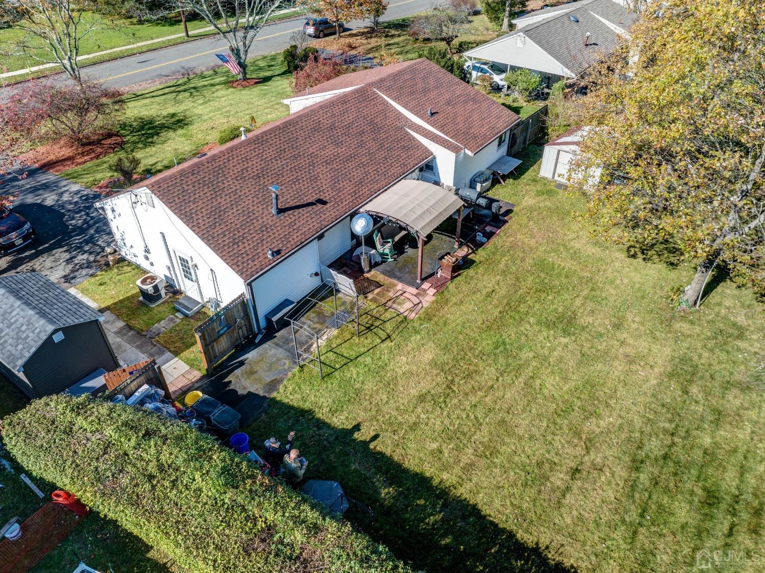 30 Cambridge Road Kendall Park, NJ 08824 - Photo 39 of 43 an aerial view of a house with a yard basket ball court and outdoor seating