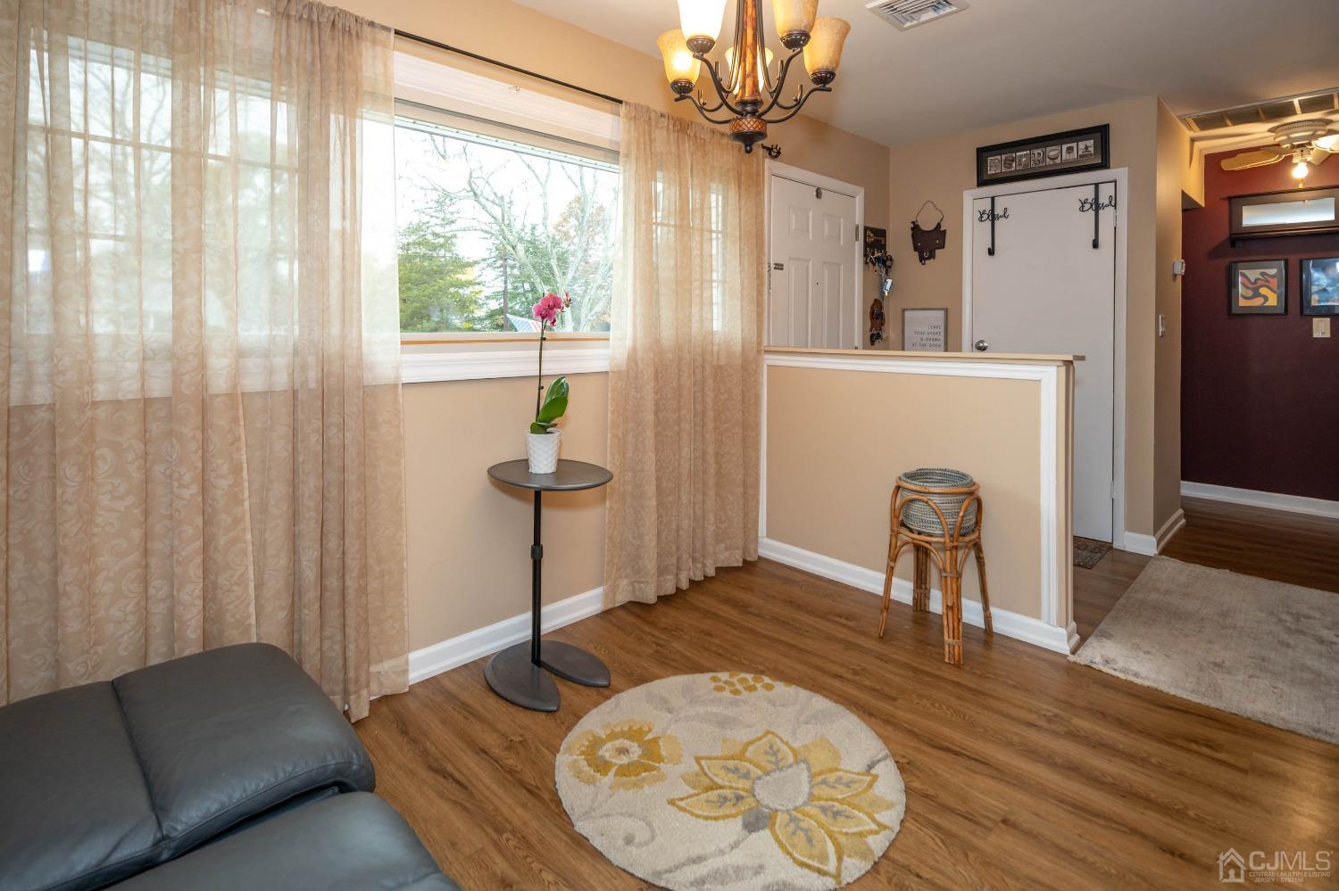 30 Cambridge Road Kendall Park, NJ 08824 - Photo 6 of 43 a living room with furniture and a window