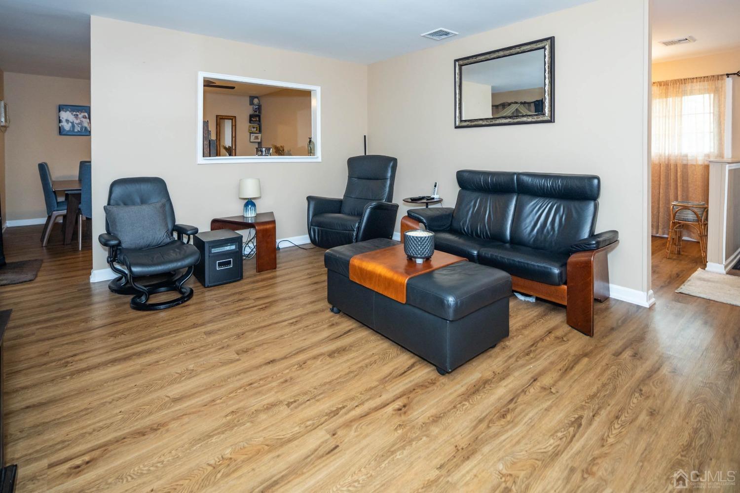 30 Cambridge Road Kendall Park, NJ 08824 - Photo 10 of 43 a living room with furniture and wooden floor