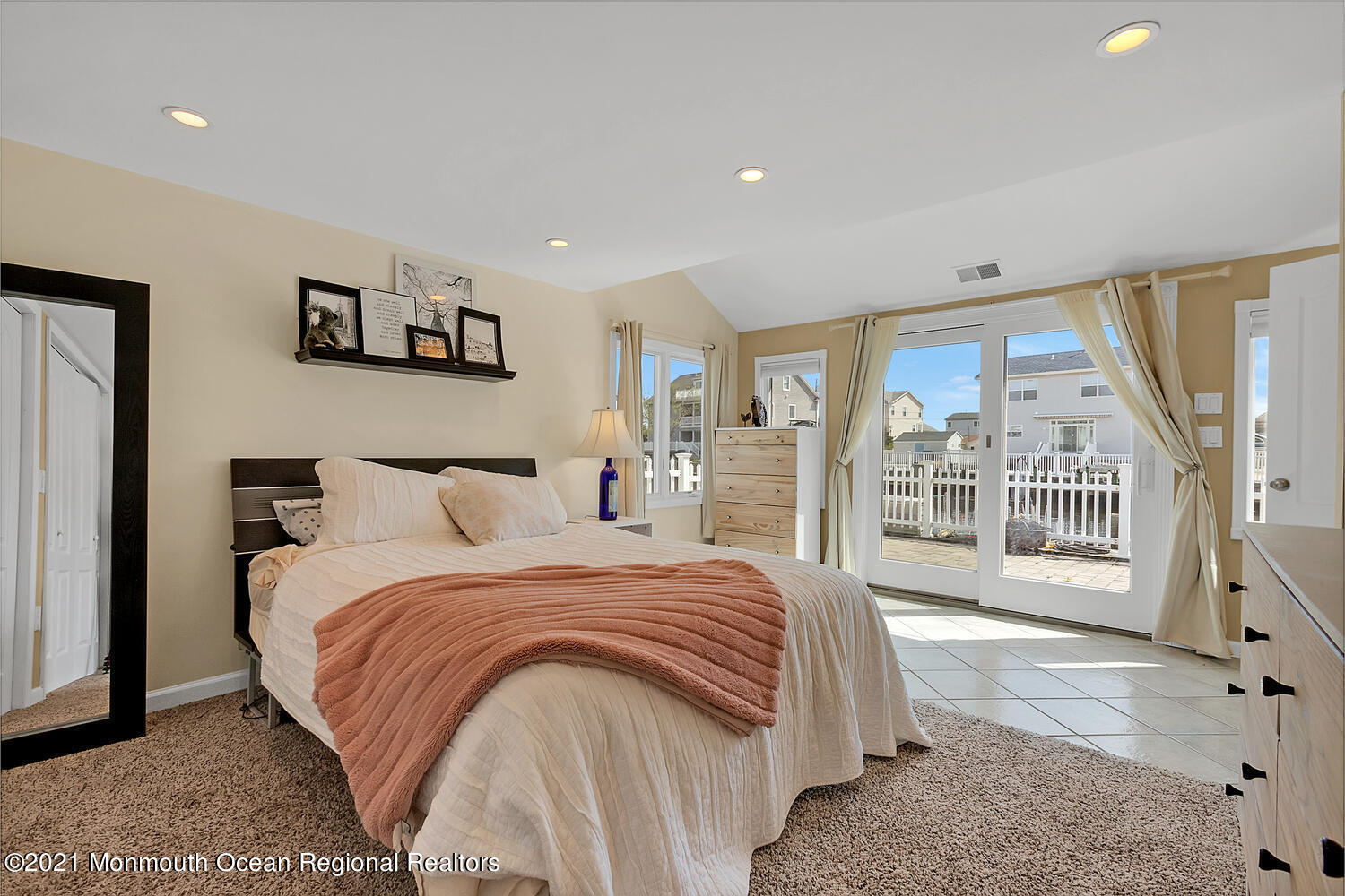 26 Capstan Road Waretown, NJ 08758 - Photo 14 of 23 a bedroom with a large bed and a large window