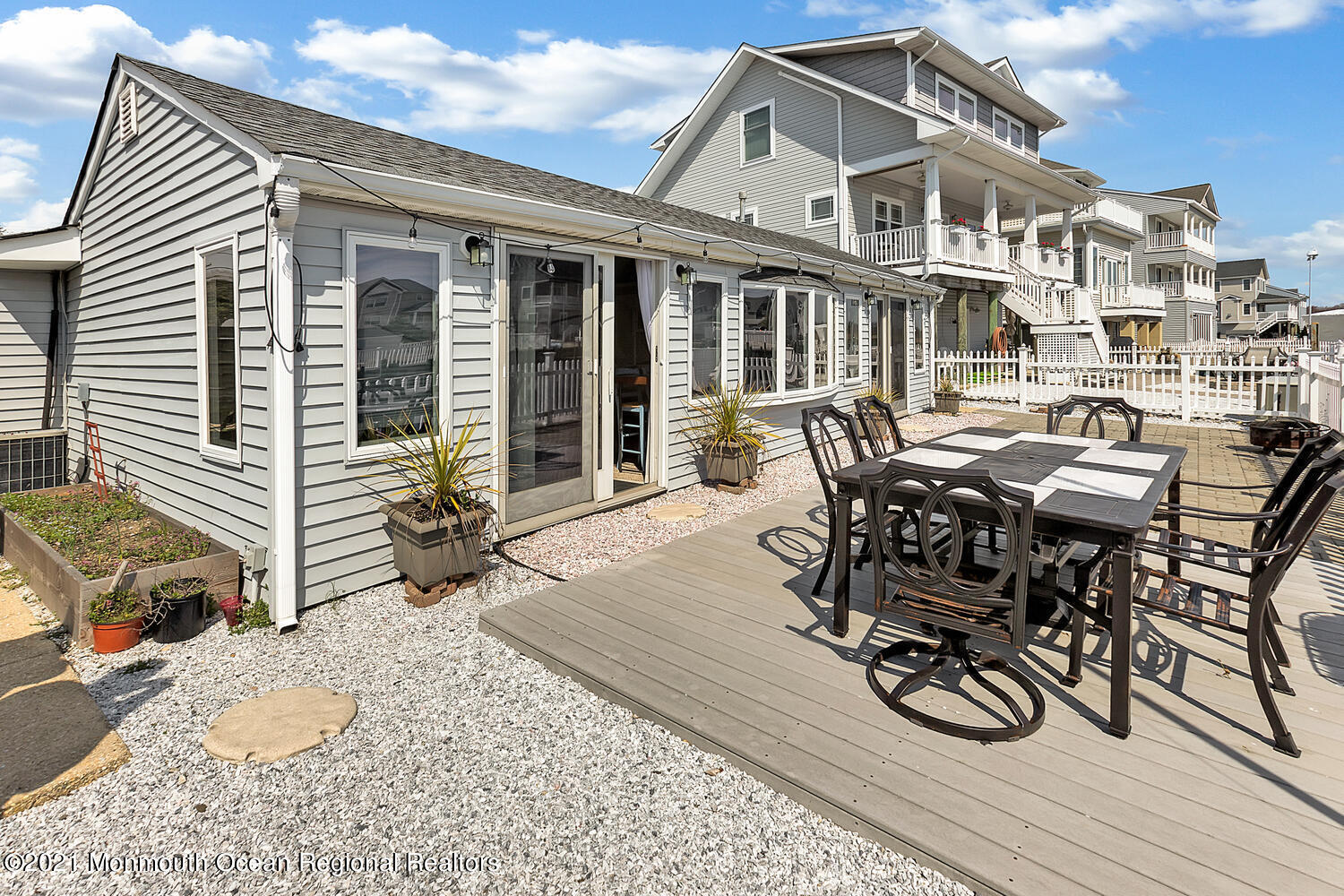 26 Capstan Road Waretown, NJ 08758 - Photo 15 of 23 a view of a dinning table and chairs in the roof deck