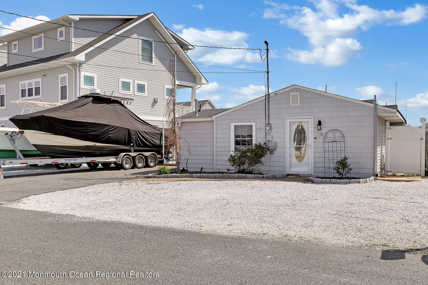 26 Capstan Road Waretown, NJ 08758 - Photo 2 of 23 a white building with a outdoor space