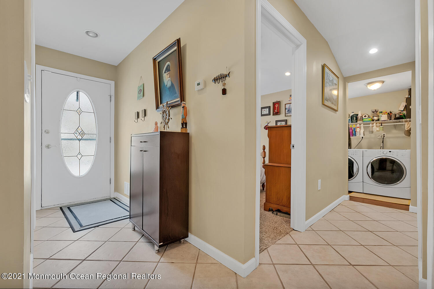 26 Capstan Road Waretown, NJ 08758 - Photo 3 of 23 a view of a livingroom with wooden floor and a refrigerator