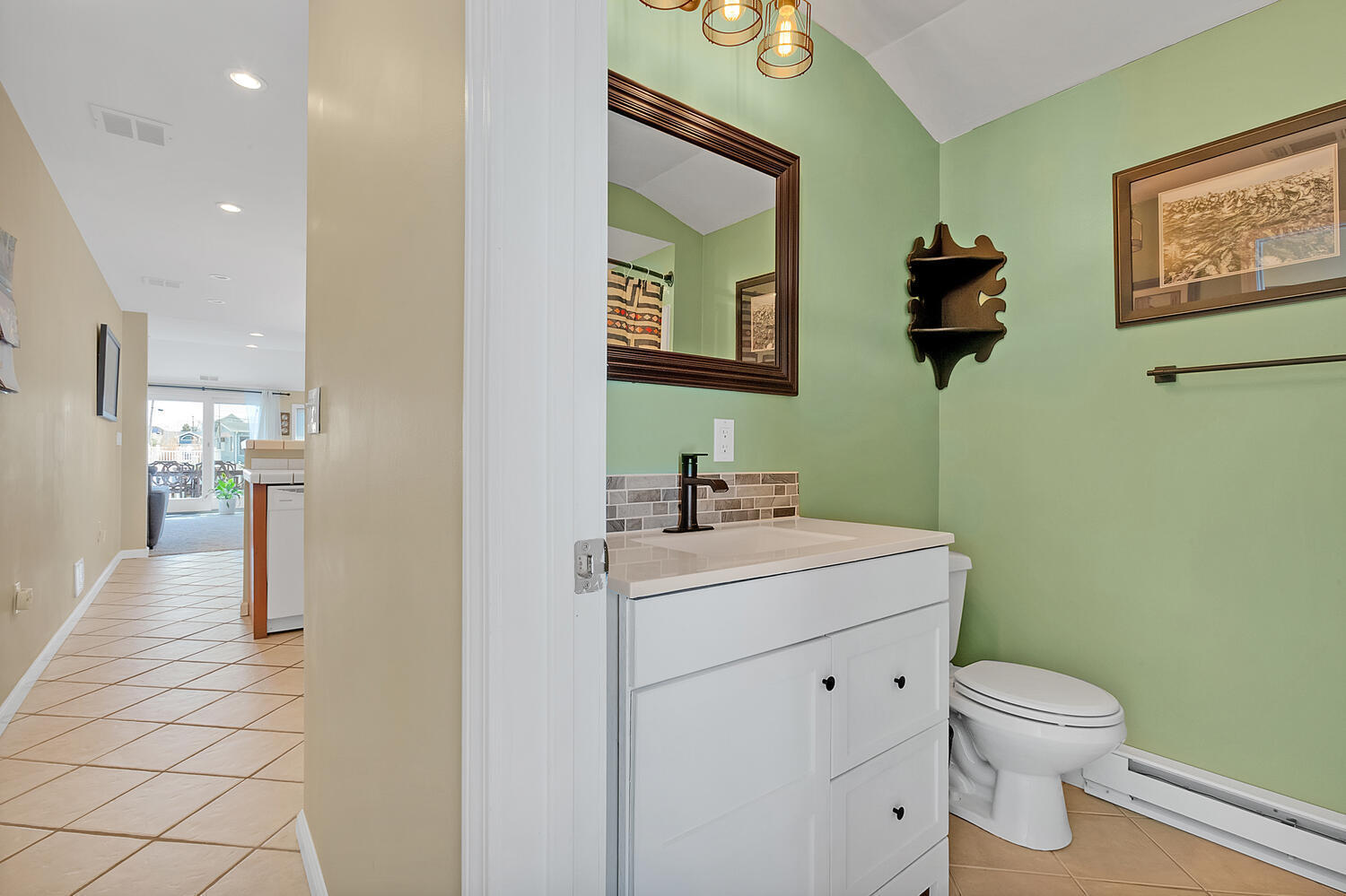 26 Capstan Road Waretown, NJ 08758 - Photo 6 of 23 a bathroom with a toilet sink and mirror