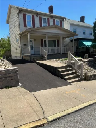 a front view of a house with swimming pool