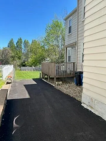 a view of a backyard with trees