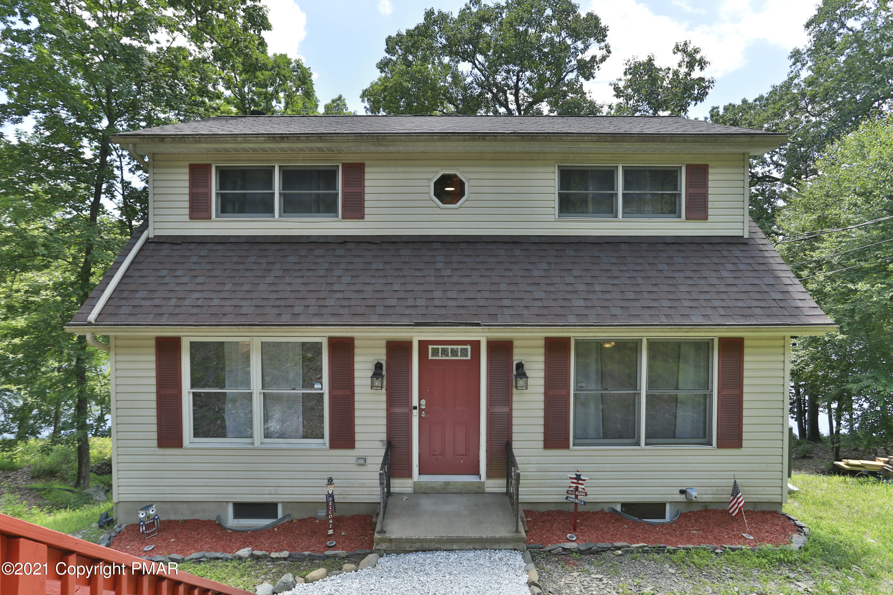 front view of a house with a yard